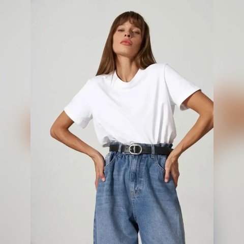 Woman wearing a white everyday cotton tee with blue jeans