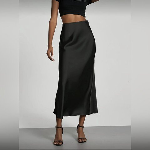 Black satin midi skirt worn with heeled sandals